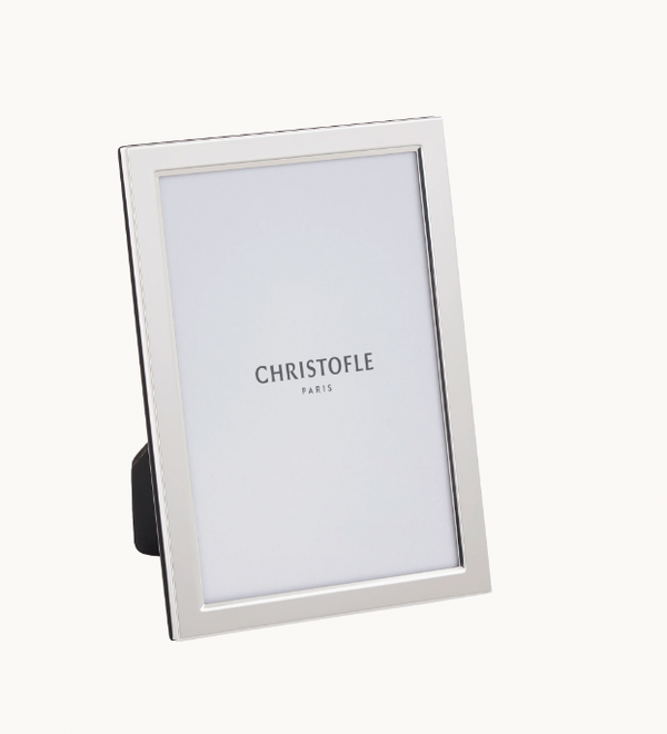 The Christofle Uni Picture Frame features a simple, modern silver design and stands upright on a white background. Ideal as an engravable photo frame, it displays the text CHRISTOFLE PARIS in its placeholder.