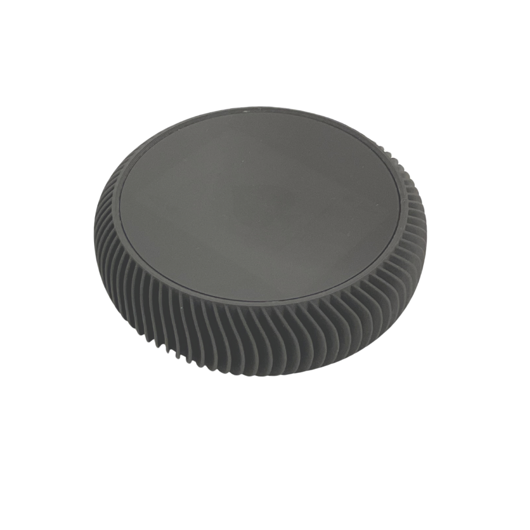 The La Redonda Round 3D Single Card Deck Holder by Luxe Dominoes is a black, disc-shaped holder with a smooth top and ribbed sides, ideal for modern card storage, shown isolated on a white background.