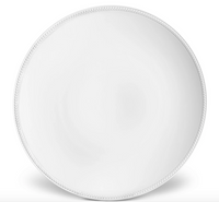 The Soie Tressée White Dinnerware by L'Objet is a round, ceramic dinner plate in white with a subtle braided border, shown from above on a white background.