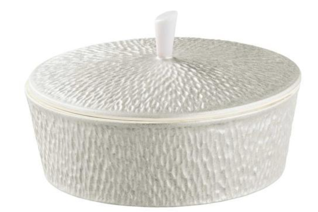 A round, textured white Limoges porcelain container with lid and a small vertical handle, from the Mineral Irise Dinnerware Pearl Grey collection by Raynaud, made in France.
