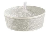 A round, textured white Limoges porcelain container with lid and a small vertical handle, from the Mineral Irise Dinnerware Pearl Grey collection by Raynaud, made in France.