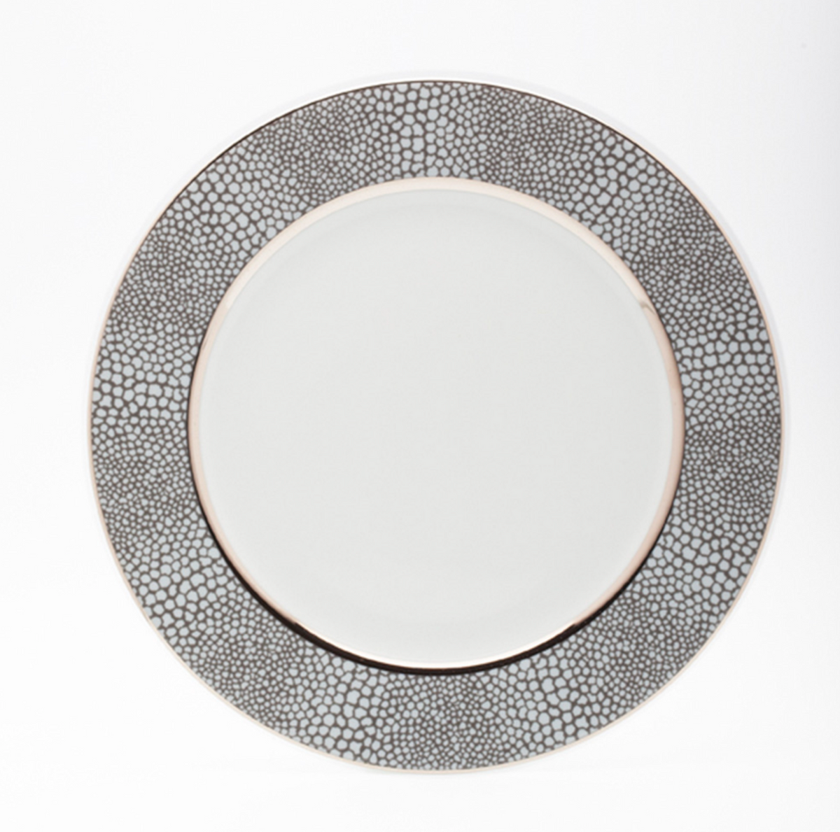 The Makassar Gray & Platinum Dinnerware by Royal Limoges/Bia Cordon Bleu is a handmade French Limoges porcelain plate with a wide, textured gray and platinum rim, shown from above against a plain white background.