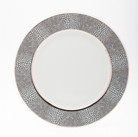 The Makassar Gray & Platinum Dinnerware by Royal Limoges/Bia Cordon Bleu is a handmade French Limoges porcelain plate with a wide, textured gray and platinum rim, shown from above against a plain white background.