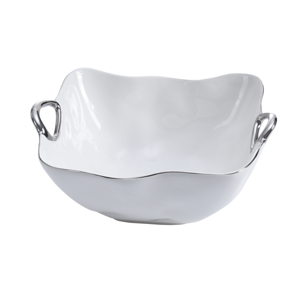 The Handle Bowl Silver Trim by PAMPA BAY is a glossy white ceramic bowl with curved edges and two silver handles, crafted from high-fired porcelain and shown on a plain white background.