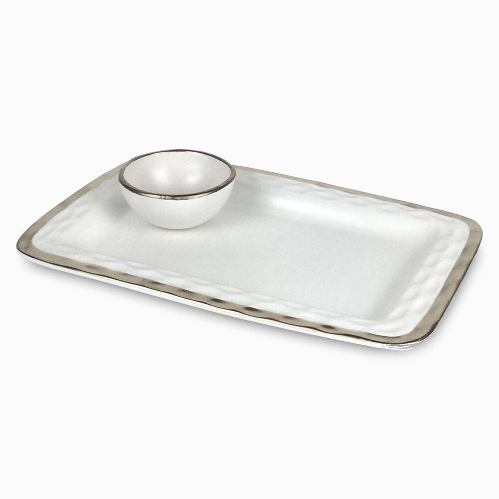 The Michael Wainwright Truro Platinum Edge Chip & Dip is a handmade rectangular white ceramic platter with a raised edge, subtle gray trim, and a matching round bowl in one corner, inspired by elegant design.