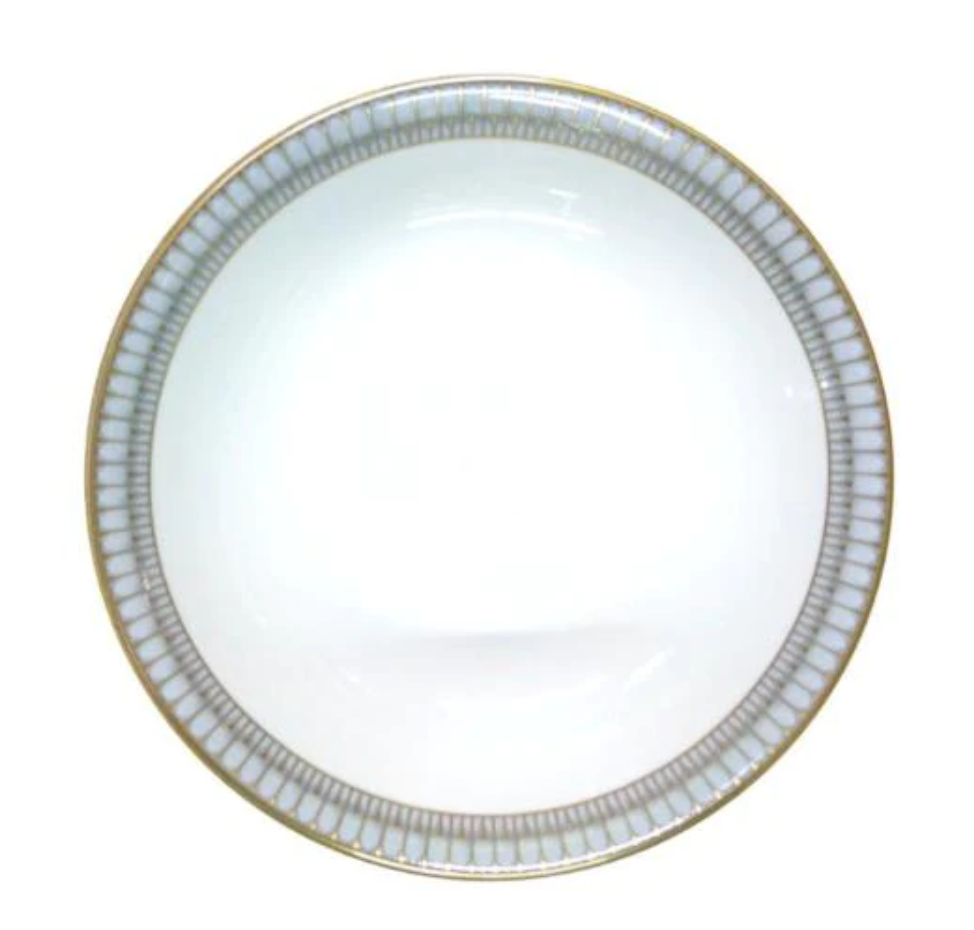 A white ceramic plate from Philippe Deshoulieres' Arcades Gold Dinnerware, with a gold and silver geometric rim, is shown from above against a plain background.