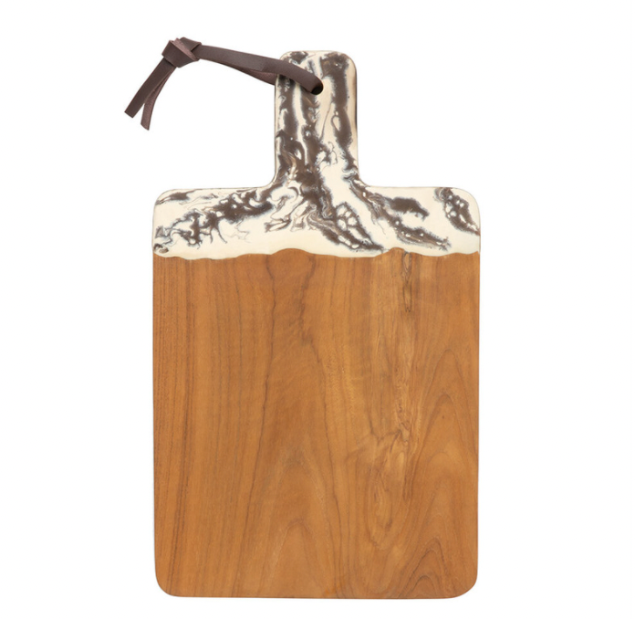 The Austin Swirled Cheeseboard by Blue Pheasant is a rectangular teak serving board with a handle, accented by decorative white and gray marbled resin at the top and finished with a brown leather loop.