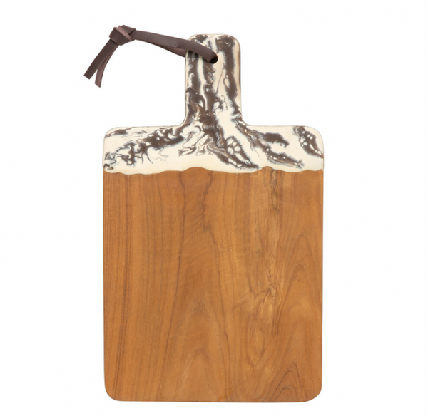The Austin Swirled Cheeseboard by Blue Pheasant is a rectangular teak serving board with a handle, accented by decorative white and gray marbled resin at the top and finished with a brown leather loop.
