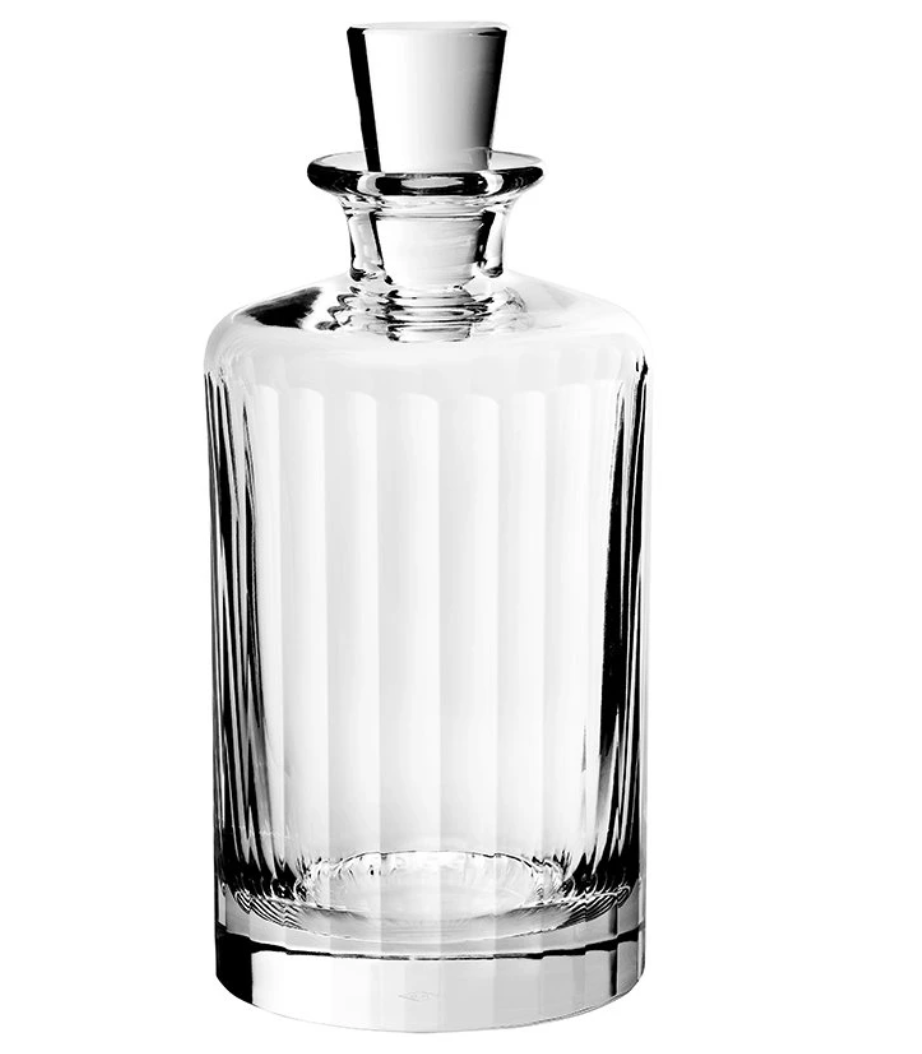 The Fluted Decanter Large by Richard Brendon is a clear, faceted mouth-blown crystal decanter with vertical etched lines and a matching glass stopper, shown on a white background.