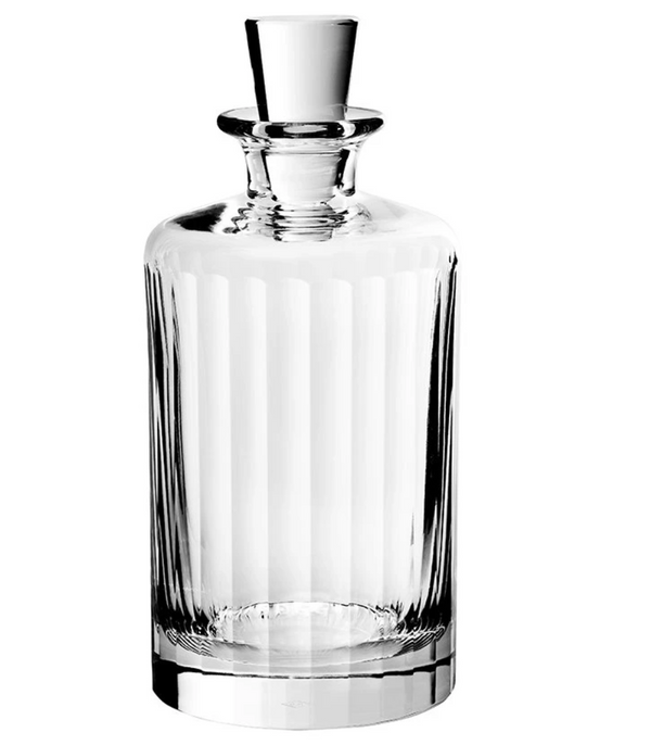 The Fluted Decanter Large by Richard Brendon is a clear, faceted mouth-blown crystal decanter with vertical etched lines and a matching glass stopper, shown on a white background.