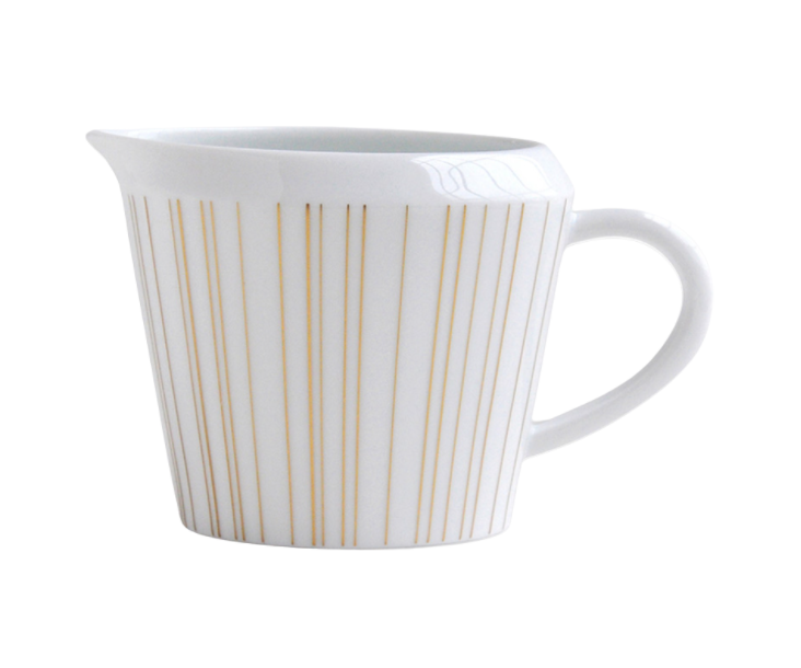 The Sol Dinnerware creamer by Bernardaud is crafted from white Limoges porcelain and features a handle, spout, and evenly spaced thin vertical gold lines around its body.