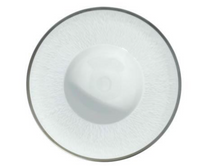 A white, round, shallow plate with a thin gray rim from Raynaud's Mineral Irise Dinnerware Platinum collection, photographed from above against a plain background.