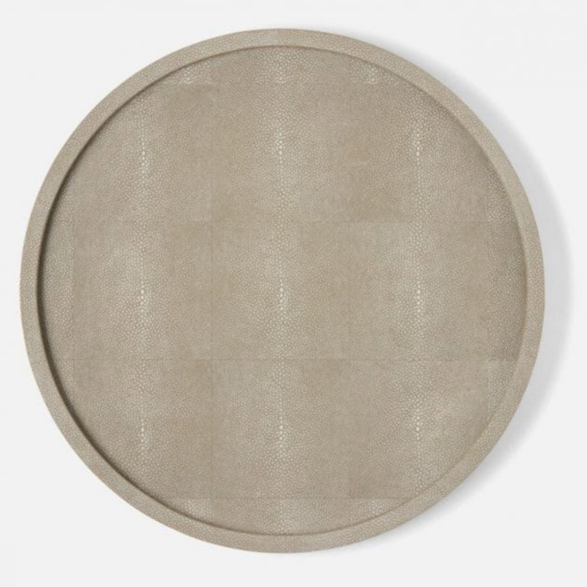 The Calvin Faux Shagreen Lazy Susan Sand by Blue Pheasant is a round, beige tray with a subtle textured finish, ideal as a tabletop centerpiece or for stylish kitchen storage, shown from above on a white background.