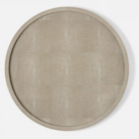 The Calvin Faux Shagreen Lazy Susan Sand by Blue Pheasant is a round, beige tray with a subtle textured finish, ideal as a tabletop centerpiece or for stylish kitchen storage, shown from above on a white background.