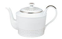 The Philippe Deshoulieres Carrousel Dinnerware teapot is crafted from white Limoges porcelain, featuring a curved handle, spout, and lid with delicate gold lines and subtle dotted gold accents near the base.