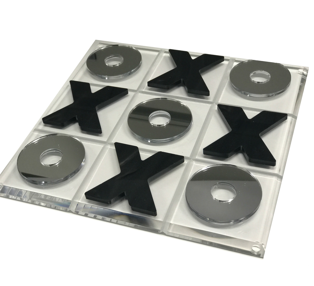 Eye Candy’s Marble & Silver Acrylic Tic Tac Toe Set features a clear acrylic 3x3 board with shiny silver O pieces and black marble X pieces, creating a modern, stylish game that enhances any space.