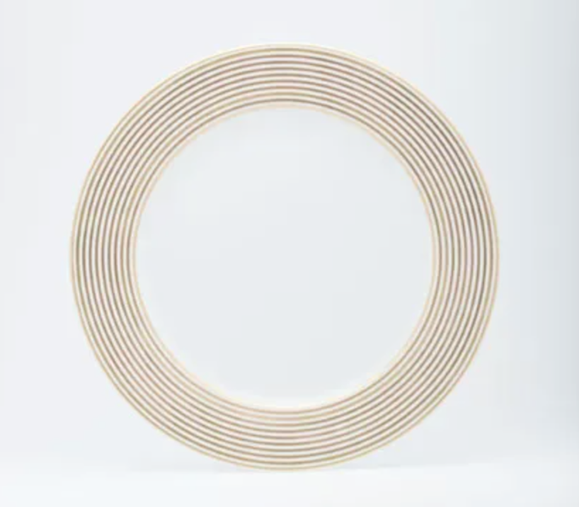 The Latitudes Dinnerware plate by Royal Limoges is a round, handmade Limoges porcelain plate with a wide rim decorated with thin beige concentric lines on white; its center remains elegantly plain and white.