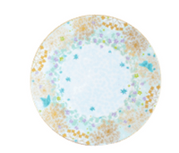 The Fèerie By Michael Cailloux round plate by Bernardaud features a pastel floral and butterfly pattern in blue, green, purple, and gold around the rim on fine Limoges porcelain with a mostly white center.