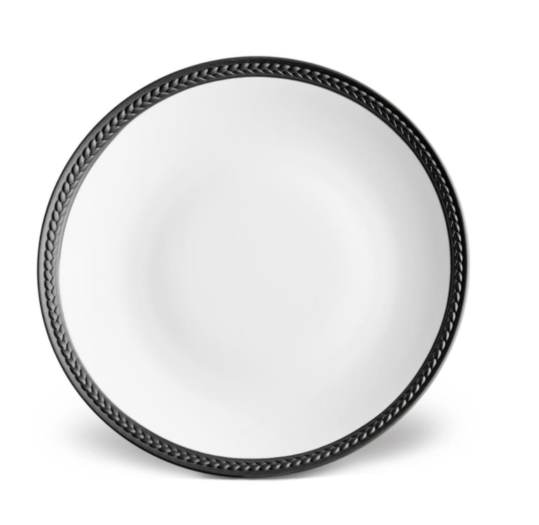 The Soie Tressée Black Dinnerware by L'Objet is a round, white luxury porcelain plate with a raised black braided rim—ideal for elevating your Limoges porcelain collection.