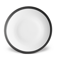 The Soie Tressée Black Dinnerware by L'Objet is a round, white luxury porcelain plate with a raised black braided rim—ideal for elevating your Limoges porcelain collection.