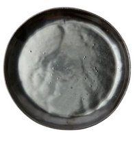 The Marcus Black Dinnerware Set of 4 by Blue Pheasant features round, dark grey stoneware plates with a glossy finish, organic silhouette, subtle uneven texture, and slightly raised rim, shown from above on a white background.
