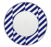The Harvard Dinnerware plate by Vista Alegre is a round white porcelain plate featuring a wide rim with diagonal navy blue and white stripes in a geometric New England-inspired pattern.