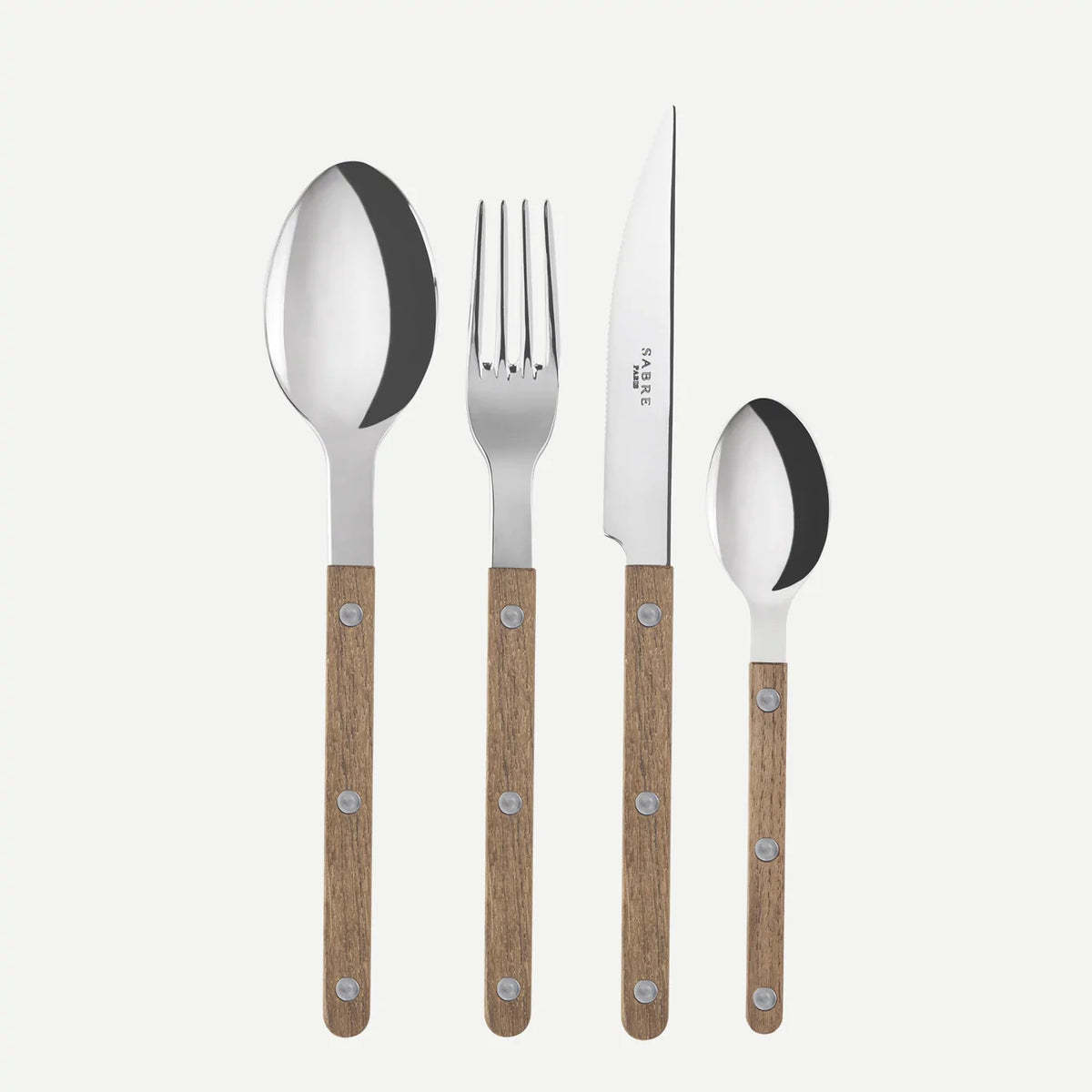 The Sabre Bistro Flatware 5 Piece Setting - Teak features stainless steel utensils with teak handles—a large spoon, fork, knife, small spoon, and dessert fork—displayed side by side on a plain white background.