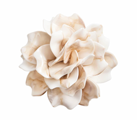 The Kim Seybert Dahlia Napkin Ring Ivory Set of 4 features elegant porcelain flower sculptures with wavy creamy white and beige petals, forming a circular bloom perfect for elevating table settings.