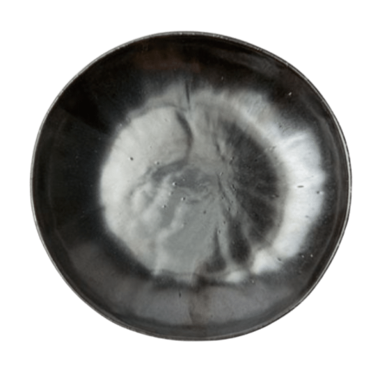 The Marcus Black Dinnerware Set of 4 by Blue Pheasant features round, shallow ceramic bowls with a glossy dark gray and black glaze and a unique cloudy white center pattern—an elegant, organic stoneware highlight for your table.