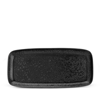 The Alchimie Dinnerware Black by L'Objet is a rectangular black ceramic plate with rounded edges and a speckled finish, displayed on a white background.