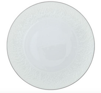 A round, white Raynaud Mineral Irise Dinnerware Platinum porcelain plate features a subtle textured rim and a thin platinum edge, shown from above on a plain white background.