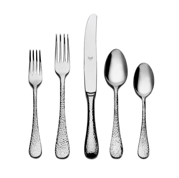 The Mepra Epoque Flatware 5 Piece Setting—two forks, a knife, and two spoons with hammered texture—is arranged side by side on a white background.