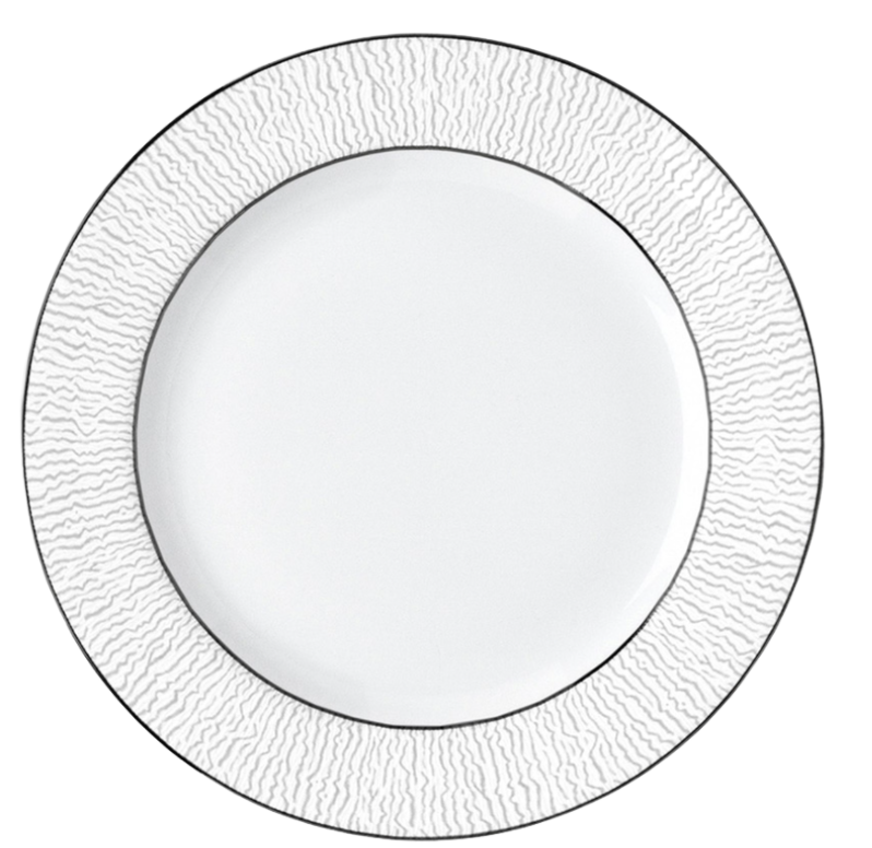 The Bernardaud Dune Dinnerware features a white handcrafted dinner plate with textured wavy lines on the rim, a smooth center, and a thin dark border—an elegant choice for any table setting.