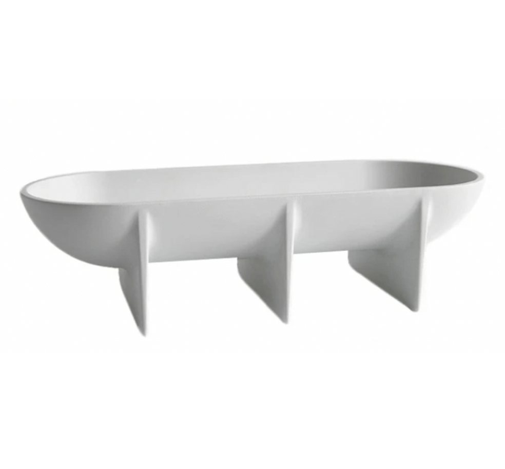 The FS Objects Standing Bowl Oval features a modern white oval design with three evenly spaced vertical support fins, serving as a sleek decorative centerpiece reminiscent of a contemporary fruit bowl.