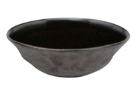 The Blue Pheasant Marcus Black Dinnerware Set of 4 features dark, round stoneware bowls with slightly flared rims and a smooth matte finish, inspired by organic shapes and shown against a white background.
