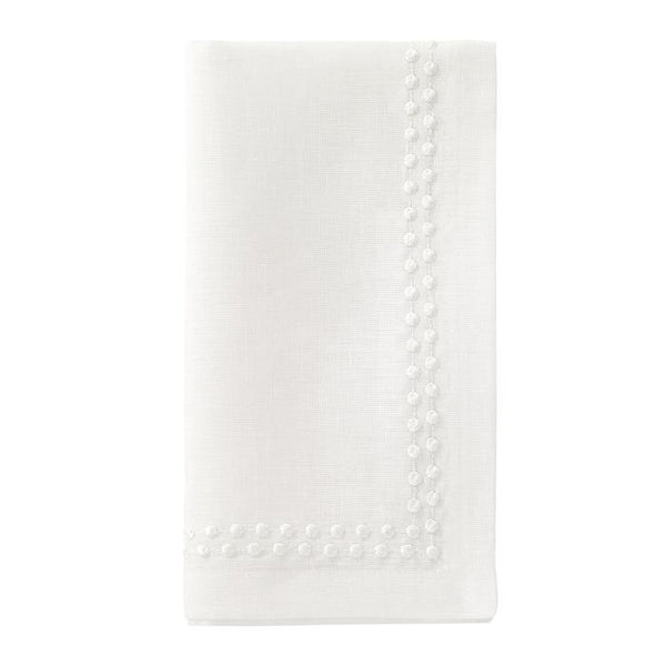 The Bodrum Pearls Napkin White Set of 4 features finely folded linen napkins with embroidered edges and small decorative dots along two sides, shown on a plain white background.