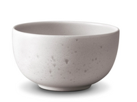 A round, light grey ceramic bowl with a speckled texture from L'Objet's Terra Stone Dinnerware, shown on a white background.