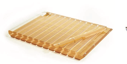 The Apeloig Striped Acrylic Challah Board & Knife | Various, set against a white background, features modern design elements reminiscent of a sushi rolling mat and crossed chopsticks.