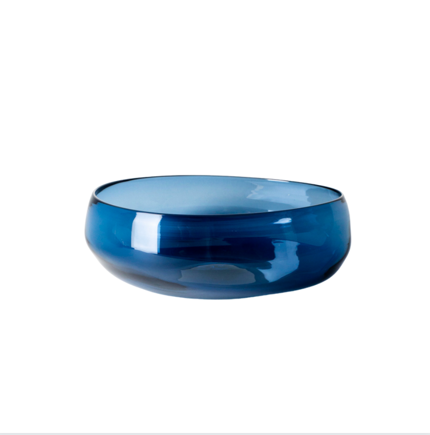 The Gary Bodker Nesting Bowls Midnight features a glossy, deep blue hand-blown bowl with smooth, rounded edges, radiating handcrafted elegance against a plain white background.