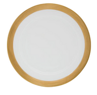 The Danielle Gold Dinnerware by Royal Limoges is a white porcelain plate featuring a wide gold band, displayed from a top-down view.