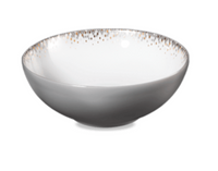 The Haviland Souffle D'or Dinnerware is a white bowl with a gray exterior and speckled gold rim, handcrafted in the style of Limoges porcelain and set against a white background.