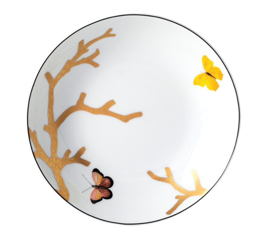 The Bernardaud Aux Oiseaux Dinnerware plate is crafted from white Limoges porcelain, featuring gold tree branch accents and two butterflies—one yellow, one pink and black—near the edges.