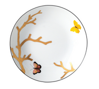 The Bernardaud Aux Oiseaux Dinnerware plate is crafted from white Limoges porcelain, featuring gold tree branch accents and two butterflies—one yellow, one pink and black—near the edges.