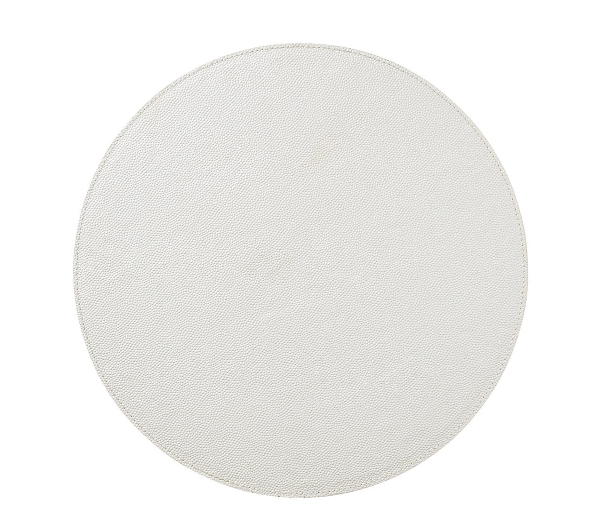 A round light gray tabletop, seen from above on a white background, offers the perfect surface to showcase Kim Seybert’s Shagreen Placemat White Set of 4 for elegant dinner parties.