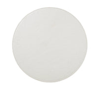 A round light gray tabletop, seen from above on a white background, offers the perfect surface to showcase Kim Seybert’s Shagreen Placemat White Set of 4 for elegant dinner parties.