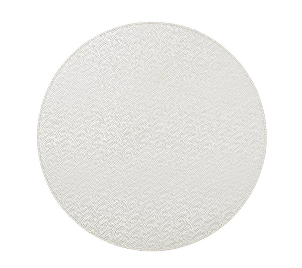A round light gray tabletop, seen from above on a white background, offers the perfect surface to showcase Kim Seybert’s Shagreen Placemat White Set of 4 for elegant dinner parties.