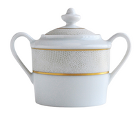 The Bernardaud Sauvage Gold Dinnerware sugar bowl features white Limoges porcelain, two handles, a lid with knob, and an embossed snake skin band highlighted by two gold lines—a refined touch to your table.