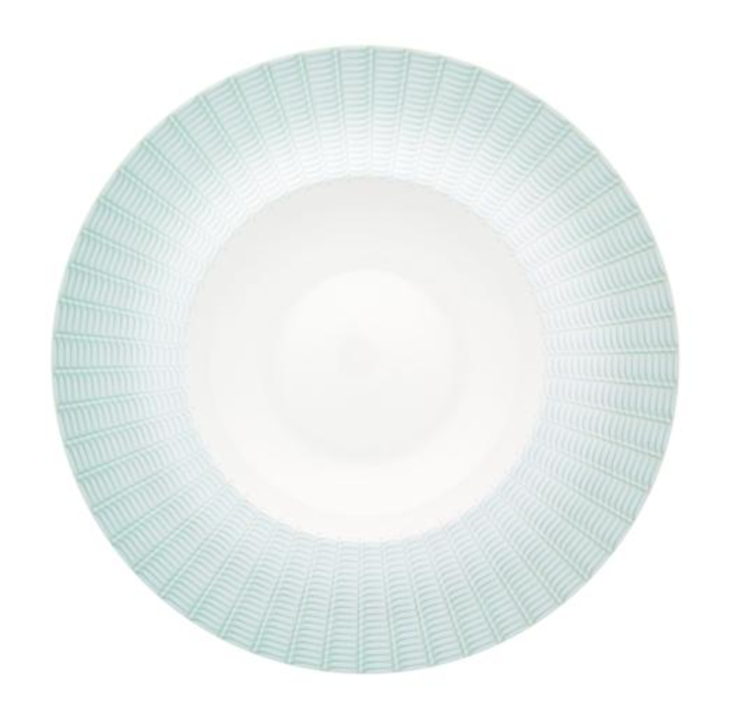 The Venezia Dinnerware by Vista Alegre features a white porcelain bowl with a wide rim and subtle light blue geometric patterns in concentric circles, adding elegance to any table.