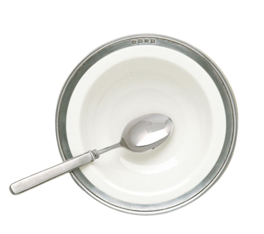 A top view of the MATCH Convivio white Italian ceramic bowl with a pewter rim, holding a silver spoon on a white background—an elegant MATCH piece from the Convivio collection.