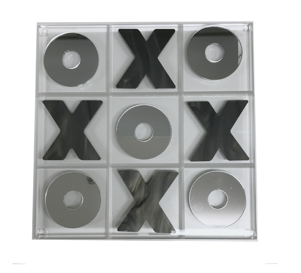 The Eye Candy Marble & Silver Acrylic Tic Tac Toe Set features a clear acrylic board with mirrored marble X and O pieces; Xs fill the top center, middle left, middle right, and bottom center squares, while Os take the other spots.